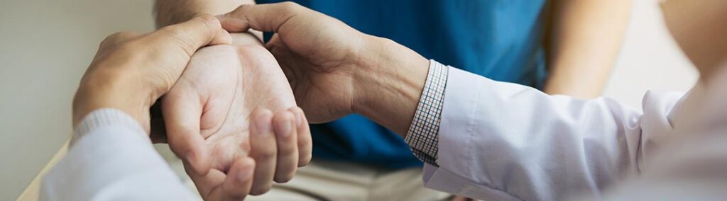 Chiropractic care can help patients dealing with arthritic pain and inflammation. Image of a doctor working with a patient's wrist.